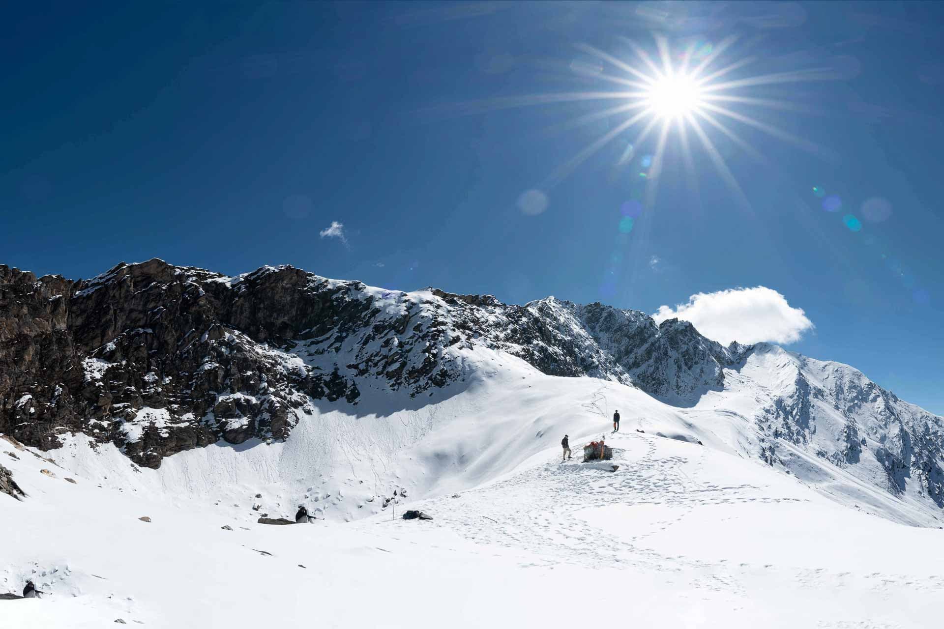 Bright sunlight, clear blue sky and mountain tops