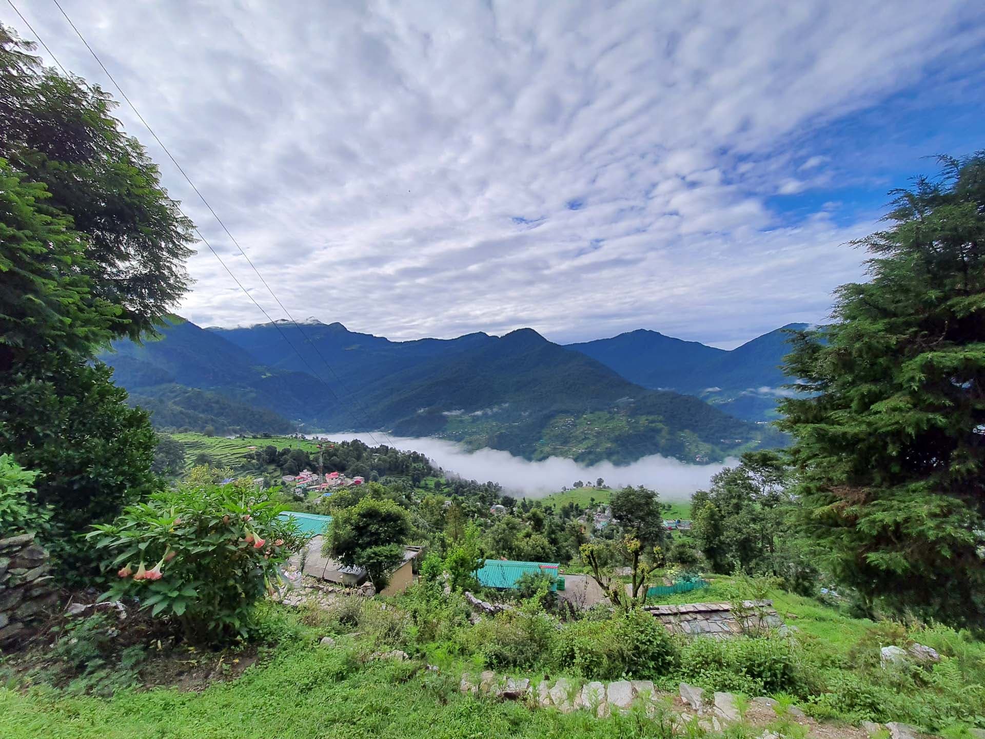 Green fields within a mountain range