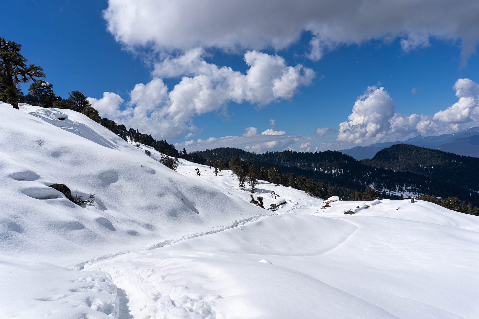 A deep snowy path in the mountains