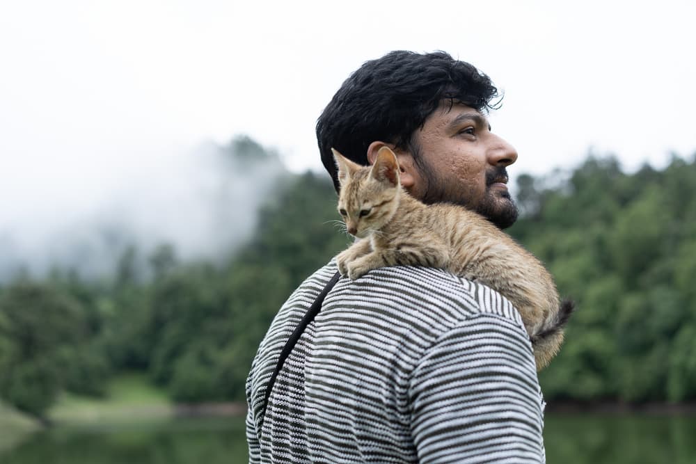 Saurav Yadav with a cat on his shoulder